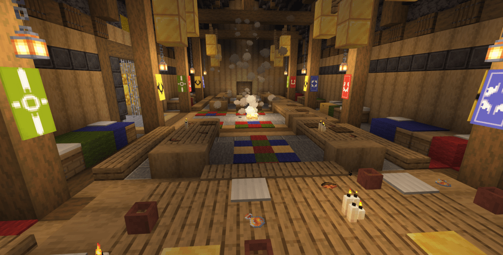 A similar view from the last imagine, but taken from the perspective of the head table, looking down the length of the hall to the small door at the other end. The campfire produces lots of smoke.